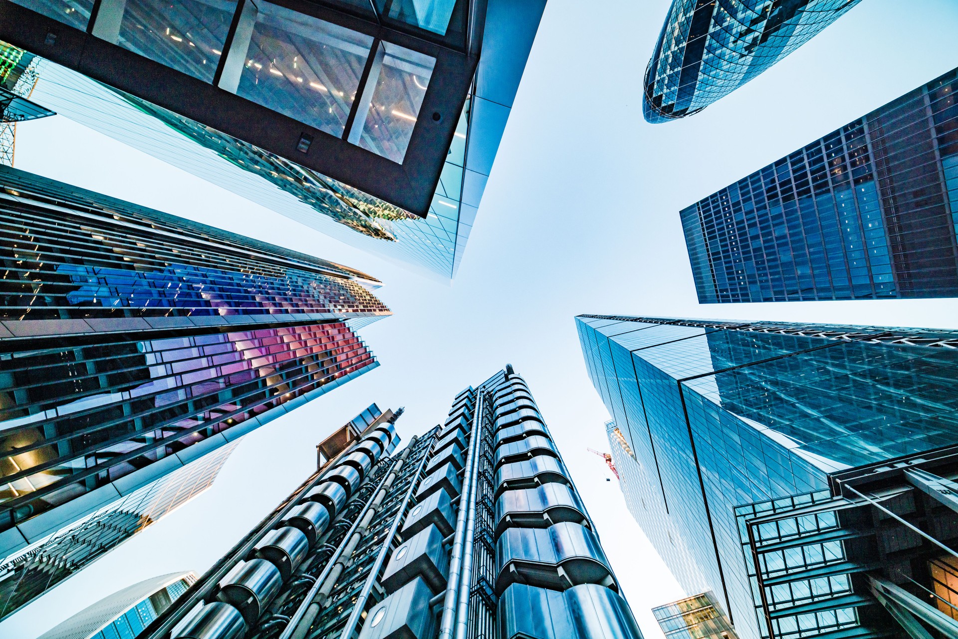 Looking directly up at the skyline of the financial district in central London, United Kingdom - creative stock image